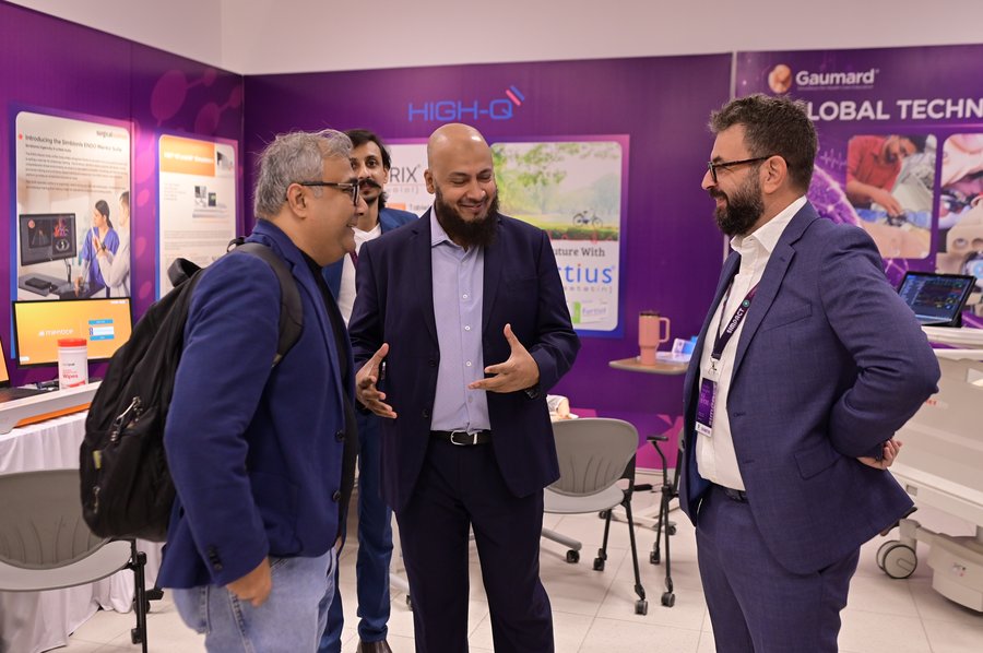 Deneb team with visitors at SIMPACT 2026 booth